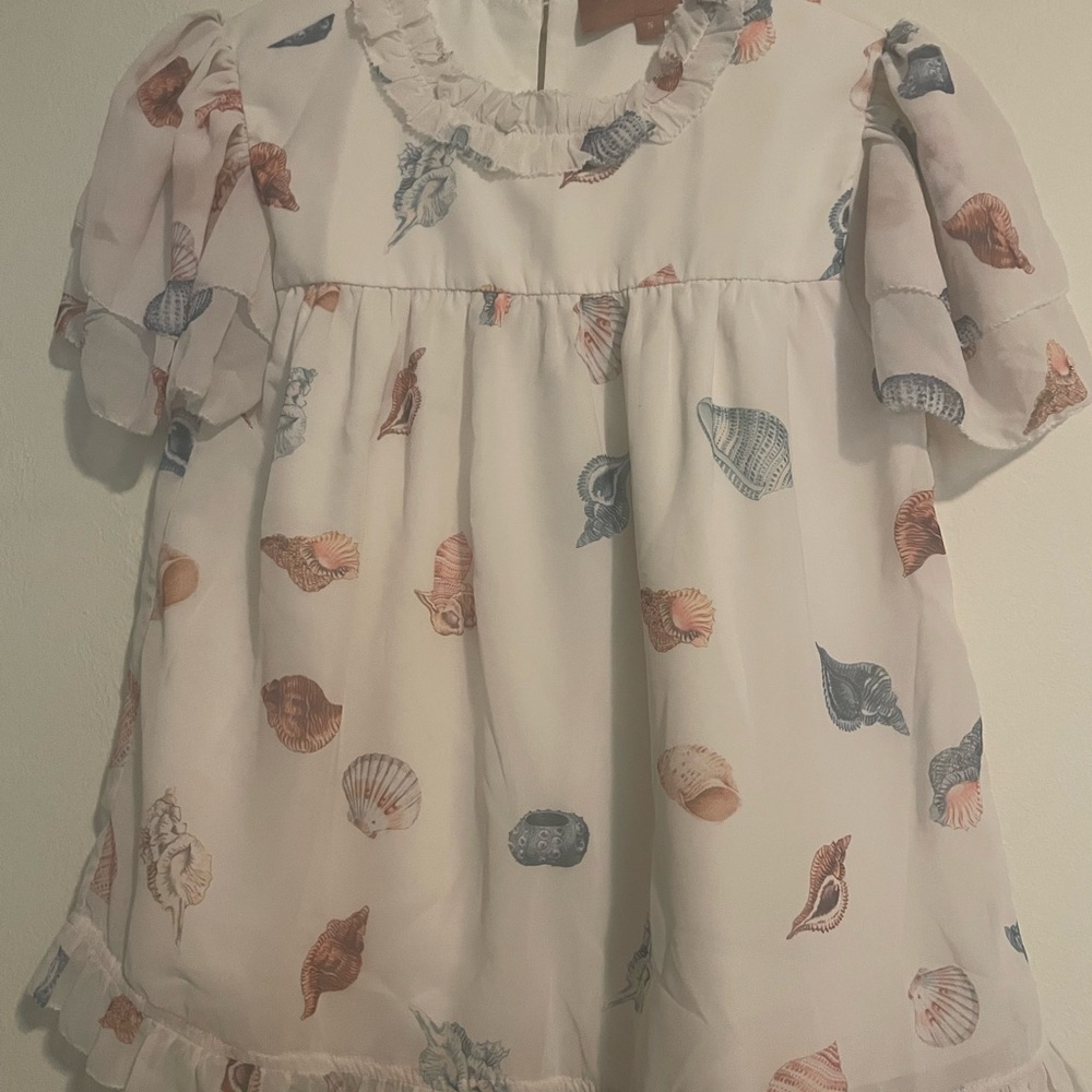 JessaKae Seashell Print top with Ruffle Detail